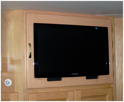 Custom bedroom RV cabinet with mounted TV